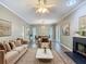 Bright living room featuring elegant furniture, fireplace, and hardwood floors for a cozy atmosphere at 1211 W Horatio St # A, Tampa, FL 33606