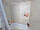 Bathroom with tiled shower and bathtub combination at 12701 N 57Th St, Tampa, FL 33617