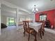 Open-concept dining room with access to the living area, perfect for entertaining guests at 12701 N 57Th St, Tampa, FL 33617