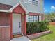 Close up of front door with brick accent and house number at 12701 N 57Th St, Tampa, FL 33617