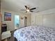 Main bedroom offering closet space, ensuite bathroom and a ceiling fan for comfort at 12701 N 57Th St, Tampa, FL 33617