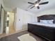 Main bedroom featuring a ceiling fan, closet and elegant bed with floral pattern comforter at 12701 N 57Th St, Tampa, FL 33617