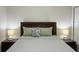 Bedroom view of bed with decorative pillows and side tables with lamps at 13009 Ridgely Cir, Port Charlotte, FL 33981