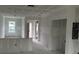 Bright, airy interior showing drywall installed and ready for the next phase of construction at 13009 Ridgely Cir, Port Charlotte, FL 33981