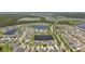 Extensive community view showcasing numerous homes, scenic ponds, and lush green spaces in a well-planned layout at 13118 Rain Lily Dr, Riverview, FL 33579