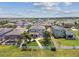 Spacious backyard with a pool, lush lawn, and fenced perimeter, providing a private oasis for outdoor enjoyment at 13118 Rain Lily Dr, Riverview, FL 33579