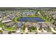Overview of the community highlighting the serene lake and well-maintained homes with lush lawns at 13118 Rain Lily Dr, Riverview, FL 33579