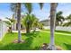 Secluded backyard with patio, fire pit, manicured landscaping, and a privacy fence for relaxing or entertaining at 13118 Rain Lily Dr, Riverview, FL 33579