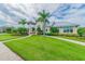 Exterior view of neighborhood clubhouse featuring manicured landscaping, sidewalks and ample parking at 13118 Rain Lily Dr, Riverview, FL 33579