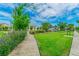 Well-maintained community park with green lawn, playground, gazebo, and seating for relaxation and recreation at 13118 Rain Lily Dr, Riverview, FL 33579