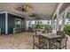 Community dining area featuring ceiling fans, tables, chairs, and a countertop bar at 13118 Rain Lily Dr, Riverview, FL 33579