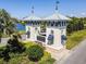 Elegant community entrance with charming architecture and beautifully landscaped surroundings, creating a welcoming arrival at 13118 Rain Lily Dr, Riverview, FL 33579