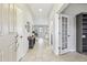 Bright and airy foyer with tile flooring and open view to the living spaces at 13118 Rain Lily Dr, Riverview, FL 33579