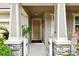 Inviting front entrance featuring stone columns and manicured landscaping at 13118 Rain Lily Dr, Riverview, FL 33579