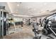 Well-equipped community gym with treadmills, weights, and ceiling fans for a comfortable workout at 13118 Rain Lily Dr, Riverview, FL 33579