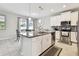 Spacious kitchen featuring an island with granite countertops and stainless steel appliances at 13118 Rain Lily Dr, Riverview, FL 33579