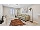 Cozy upstairs loft with comfortable seating, attractive flooring, and ample natural light at 13118 Rain Lily Dr, Riverview, FL 33579