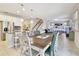 Open concept living space with kitchen, dining, and living areas featuring tile floors and modern design at 13118 Rain Lily Dr, Riverview, FL 33579