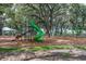 Community playground shaded by mature trees, offering a fun and safe recreational space for children at 13118 Rain Lily Dr, Riverview, FL 33579
