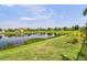 Scenic pond view surrounded by lush landscaping and serene atmosphere, offering a peaceful natural retreat at 13118 Rain Lily Dr, Riverview, FL 33579