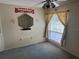 A bedroom decorated with sports team logos, offering a personalized space with ample natural light and closet space at 1371 Pine Ridge E Cir # B8, Tarpon Springs, FL 34688