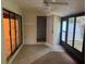 The sunroom offers a peaceful retreat with tiled floors and access to the outdoors through sliding glass doors at 1371 Pine Ridge E Cir # B8, Tarpon Springs, FL 34688