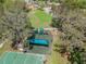Aerial view of playground and basketball court, showcasing recreational amenities within the community at 15135 Azra Dr, Odessa, FL 33556