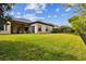 Expansive backyard with lush green lawn and well-maintained landscaping at 15135 Azra Dr, Odessa, FL 33556