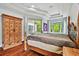 Bedroom featuring wooden floors, large bed, modern ceiling, and natural light at 15135 Azra Dr, Odessa, FL 33556