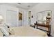 Bedroom with a bed, closet and decorative furniture with artwork at 15135 Azra Dr, Odessa, FL 33556