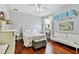 Comfortable bedroom with hardwood floors, soft lighting, and ample closet space at 15135 Azra Dr, Odessa, FL 33556