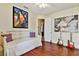 Charming bedroom features hardwood floors and stylish decor, creating a unique and inviting space at 15135 Azra Dr, Odessa, FL 33556