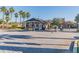 Gated community entrance with stone pillars and manicured landscaping, ensures privacy and security at 15135 Azra Dr, Odessa, FL 33556