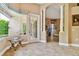 Open and bright foyer with tile floors leading to an outdoor view at 15135 Azra Dr, Odessa, FL 33556