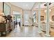 Spacious foyer with tile floors, ornate console table, and decorative columns providing a grand entrance at 15135 Azra Dr, Odessa, FL 33556