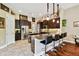 Beautiful kitchen with stainless steel appliances, granite counters, and dark wood cabinets at 15135 Azra Dr, Odessa, FL 33556