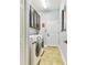 Laundry room with a washer, dryer, and upper cabinets for storage at 15135 Azra Dr, Odessa, FL 33556