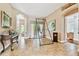 Open living room area with unique decor, including a hanging swing and stylish furniture at 15135 Azra Dr, Odessa, FL 33556