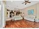 Bright living room featuring hardwood floors and view into kitchen at 15135 Azra Dr, Odessa, FL 33556