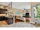 Open-concept living room with hardwood floors, comfortable seating, and stylish decor at 15135 Azra Dr, Odessa, FL 33556