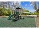 Community playground with slides and climbing features, offers a fun space for to play outdoors at 15135 Azra Dr, Odessa, FL 33556