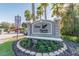 Community entrance sign surrounded by lush landscaping, showcasing the Grey Hawk at Lake Polo neighborhood at 15135 Azra Dr, Odessa, FL 33556
