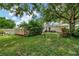 Backyard featuring a fenced pool, a hot tub, a grill and mature trees for shade at 1524 Essex N Dr, St Petersburg, FL 33710