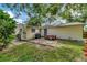 Backyard featuring a grill, hot tub, and a concrete patio, ideal for outdoor gatherings at 1524 Essex N Dr, St Petersburg, FL 33710