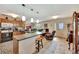 Open-concept kitchen featuring an island with bar seating and views into the living area at 1524 Essex N Dr, St Petersburg, FL 33710