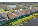 Aerial view of homes along a lake in a well-planned community at 15528 Corona Del Mar Dr, Wimauma, FL 33598