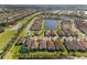 Aerial view of lakeside homes in a Primary-planned community with lush landscaping at 15528 Corona Del Mar Dr, Wimauma, FL 33598