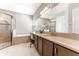 Bright bathroom featuring a combination shower and bathtub at 15528 Corona Del Mar Dr, Wimauma, FL 33598