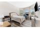 Bright bedroom with a bed, computer desk, and lots of natural light at 15528 Corona Del Mar Dr, Wimauma, FL 33598