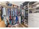 Walk-in closet with extensive shelving and clothing racks at 15528 Corona Del Mar Dr, Wimauma, FL 33598